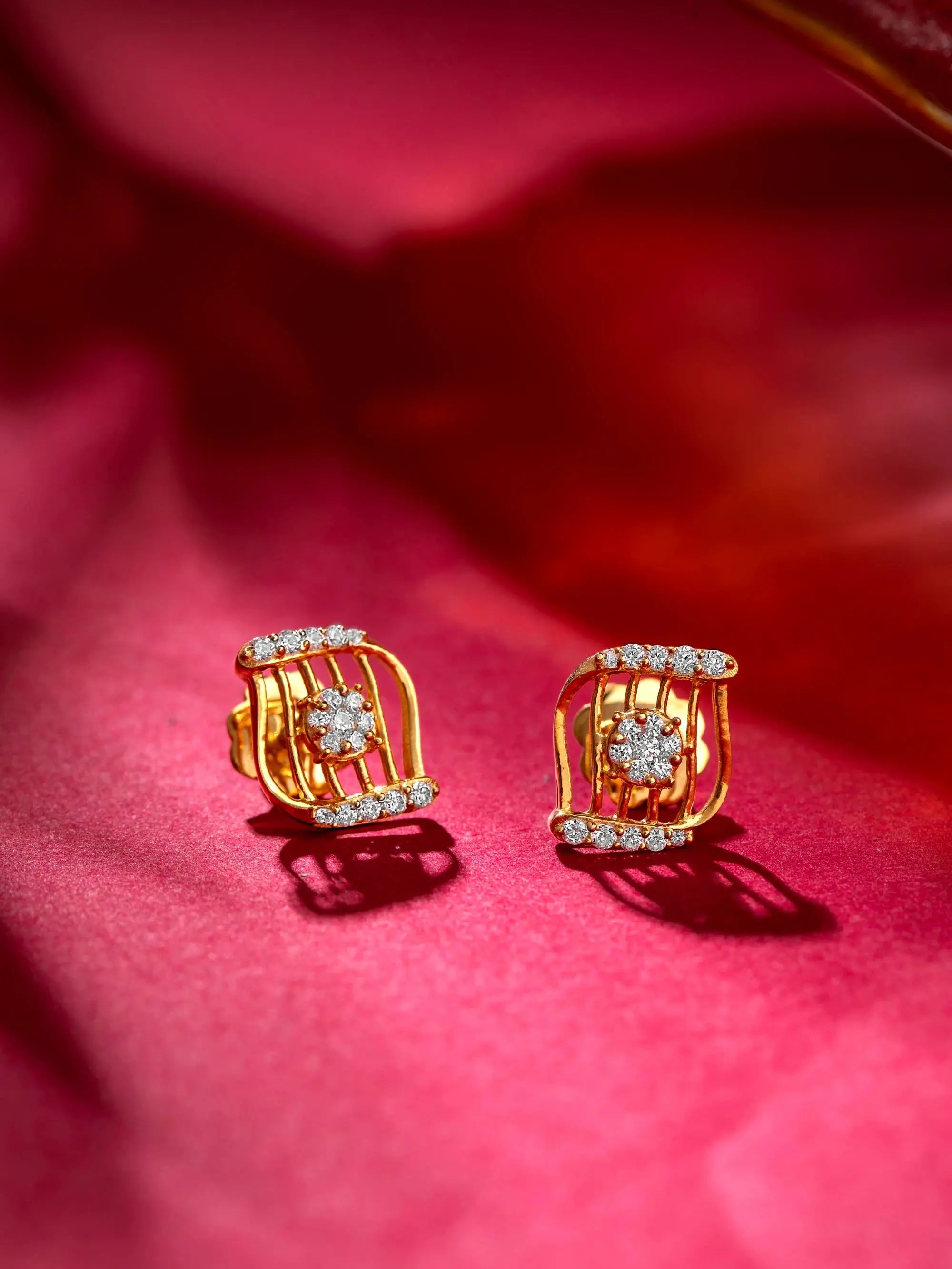 The Diamond Wave 18K gold wave-pattern diamond studs by AuDiam