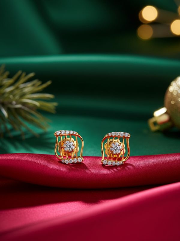 Diamond Wave 18K gold diamond studs by AuDiam on a red and green fabric background