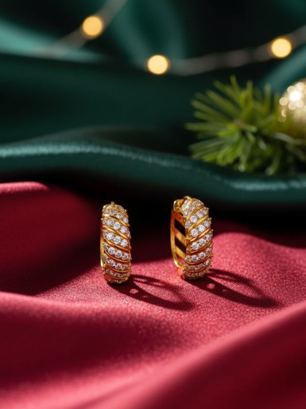 AuDiam Hoops Time 1 18K gold diamond earrings – Christmas gift for her on a red fabric background